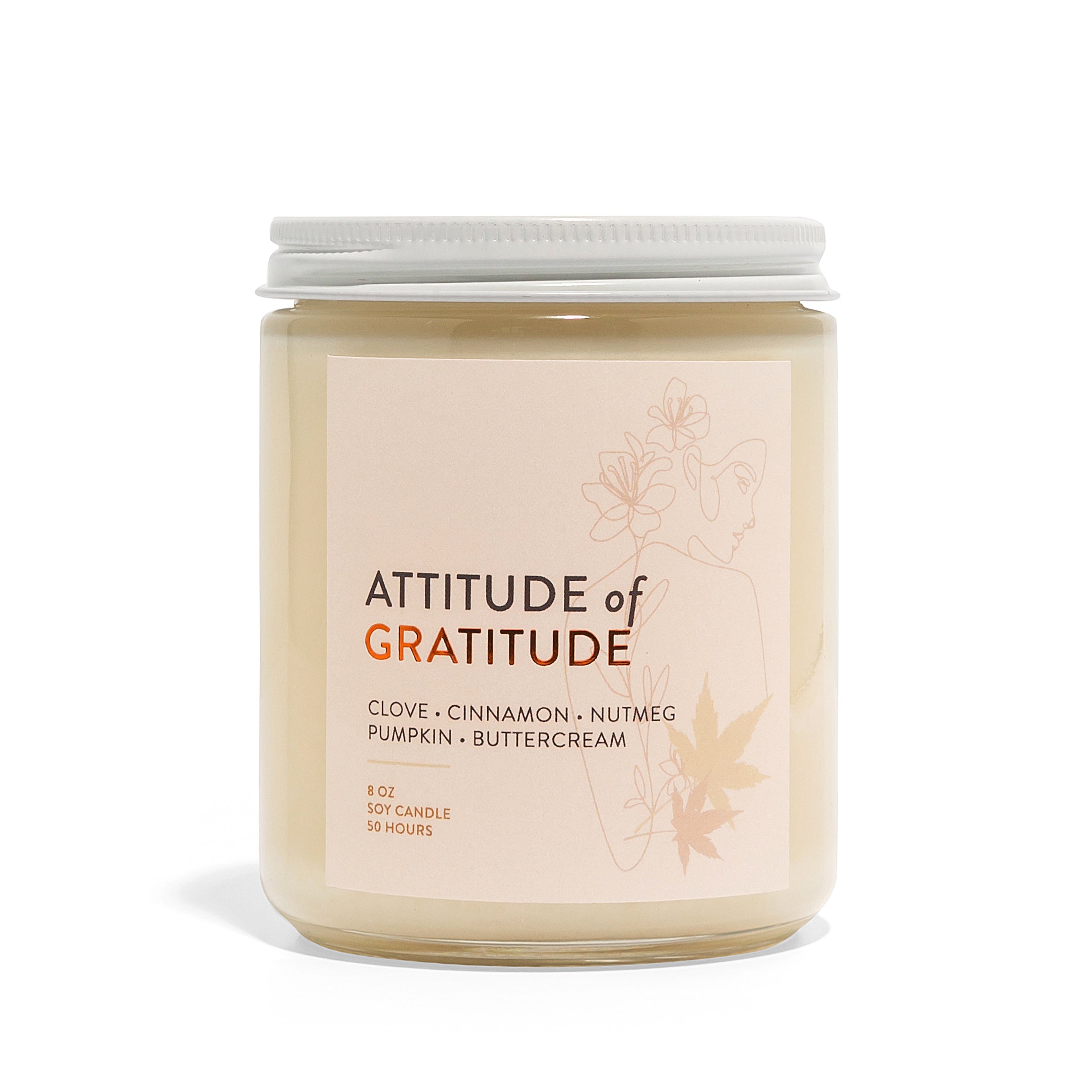 Candle jar labeled 'Attitude of Gratitude' on a white background
