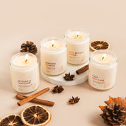 Set of candles with decorative elements on a neutral background